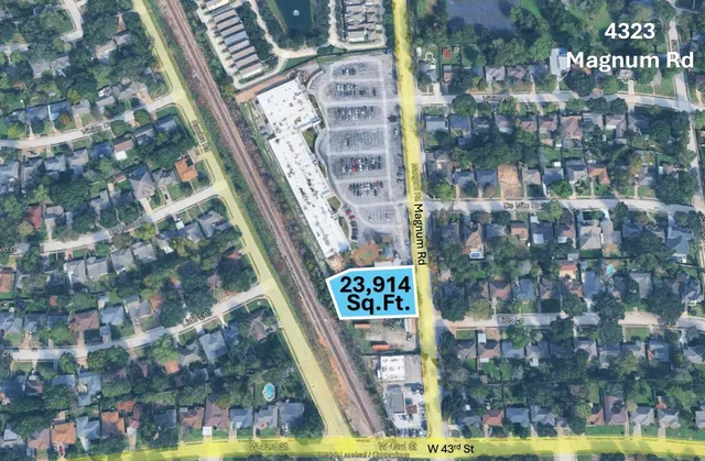 a sign on the wall next to a road