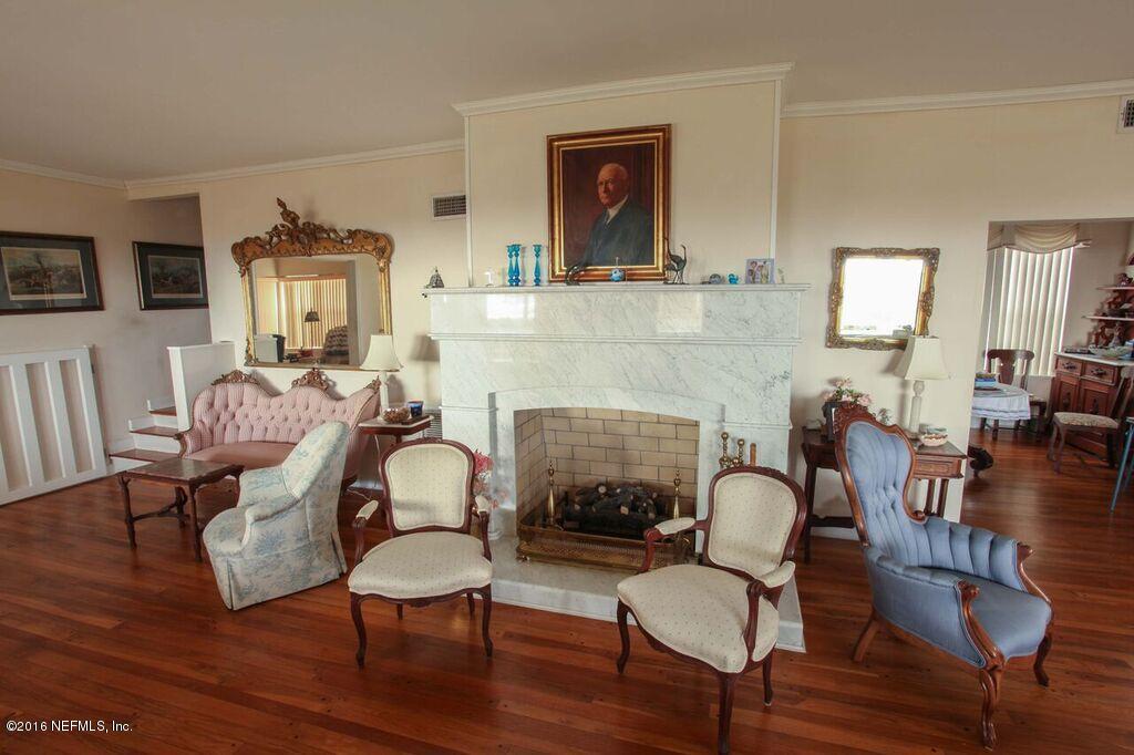 318 Ocean Front Neptune Beach, FL 32266 - Photo 11 of 26 a living room with furniture and a fireplace