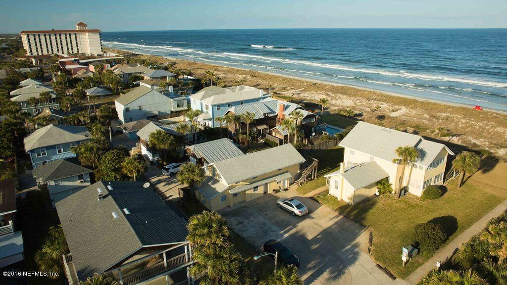 318 Ocean Front Neptune Beach, FL 32266 - Photo 12 of 26 a view of a livingroom with furniture and floor to ceiling window