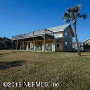 318 Ocean Front Neptune Beach, FL 32266 - Photo 26 of 26 a front view of a house with a garden