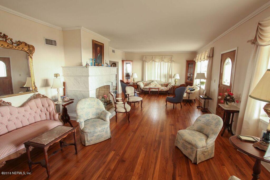 318 Ocean Front Neptune Beach, FL 32266 - Photo 3 of 26 a living room with fireplace furniture and a wooden floor