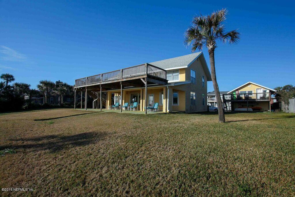 318 Ocean Front Neptune Beach, FL 32266 - Photo 5 of 26 a front view of a house with a garden