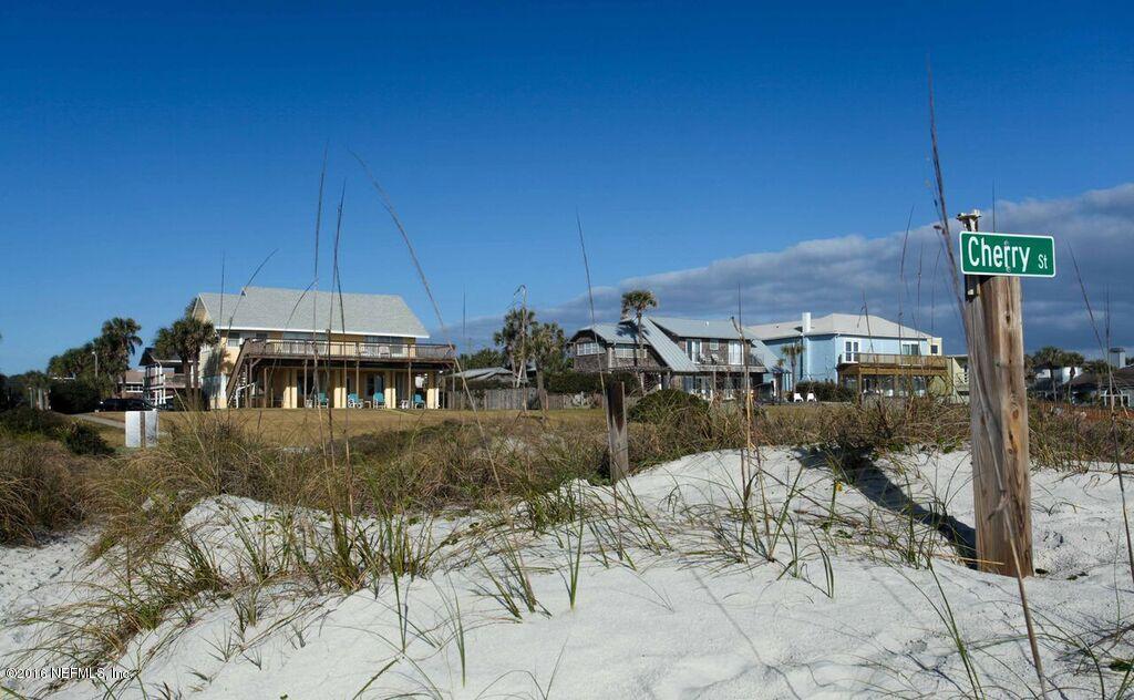 318 Ocean Front Neptune Beach, FL 32266 - Photo 8 of 26 a view of a patio with table and chairs under an umbrella