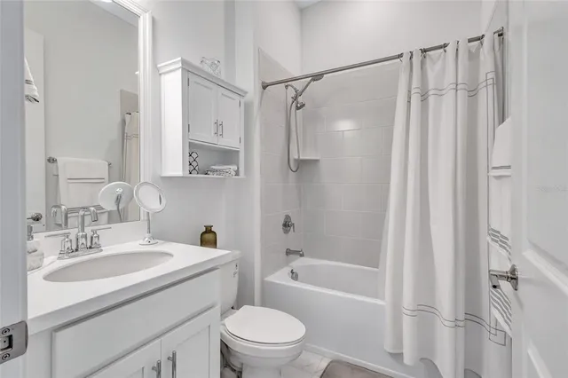 a kitchen with stainless steel appliances kitchen island granite countertop a refrigerator and a stove top oven