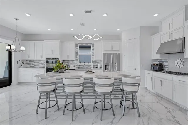 a utility room with sink dryer and washer