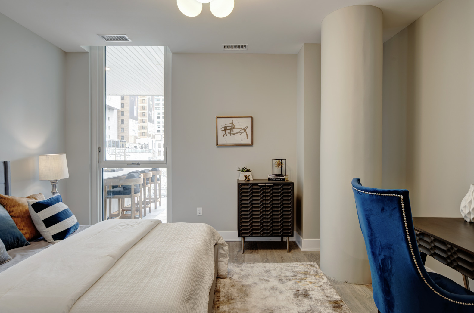 144 West Erie Street, Unit 401 Chicago, IL 60654 - Photo 15 of 25 a bedroom with a bed and a window