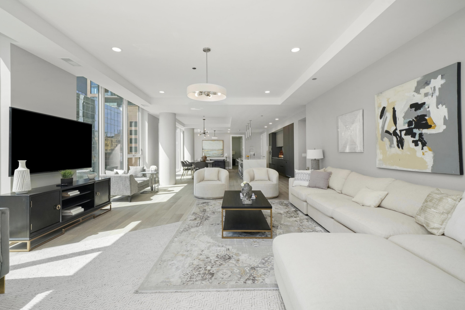 144 West Erie Street, Unit 401 Chicago, IL 60654 - Photo 2 of 25 a living room with furniture and a flat screen tv