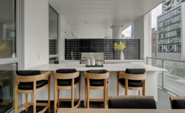 144 West Erie Street, Unit 401 Chicago, IL 60654 - Photo 21 of 25 a kitchen with a dining table and chairs