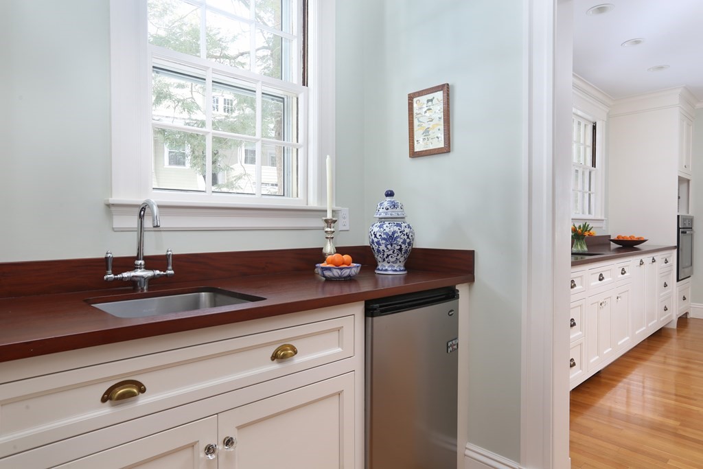 34 Livermore Road Wellesley, MA 02481 - Photo 11 of 36 a bath room with a sink and cabinets