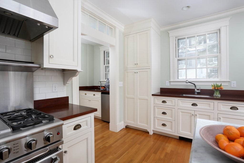 34 Livermore Road Wellesley, MA 02481 - Photo 15 of 36 a kitchen with granite countertop a stove and a wooden floors