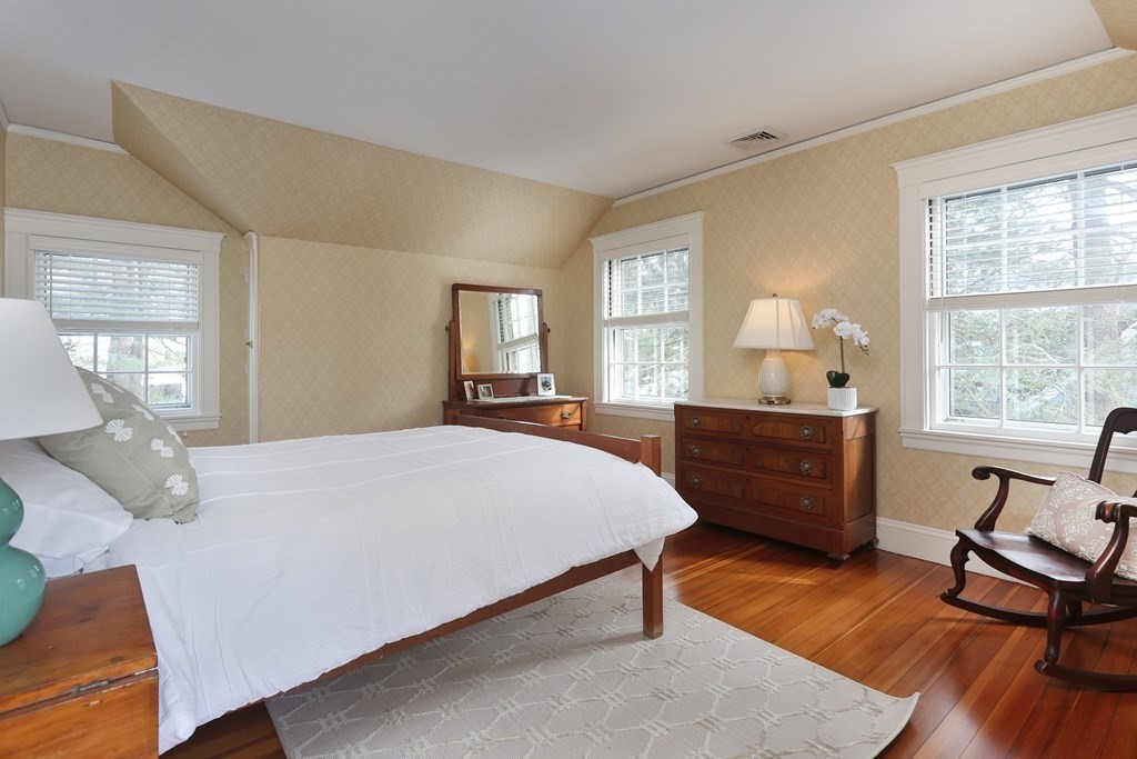 34 Livermore Road Wellesley, MA 02481 - Photo 24 of 36 a bedroom with a bed and wooden floor
