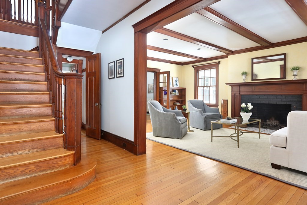 34 Livermore Road Wellesley, MA 02481 - Photo 3 of 36 a living room with furniture a fireplace and a floor to ceiling window