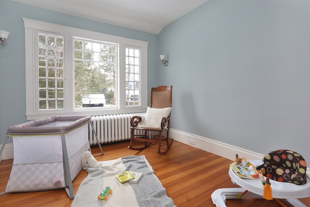 34 Livermore Road Wellesley, MA 02481 - Photo 31 of 36 a bedroom with furniture and a wooden floor