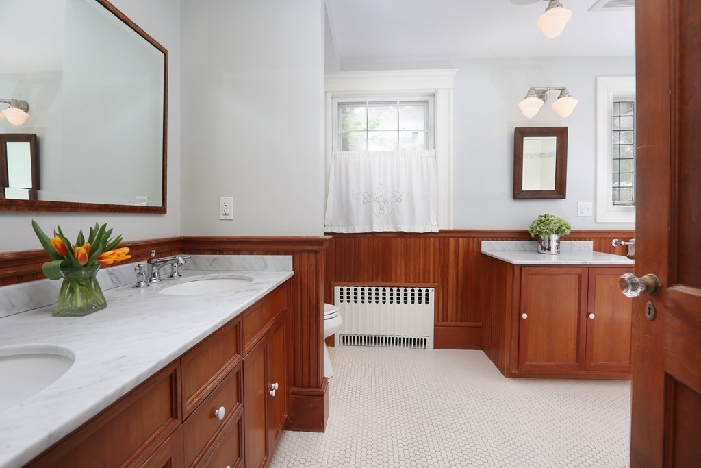 34 Livermore Road Wellesley, MA 02481 - Photo 32 of 36 a bathroom with a sink and a mirror