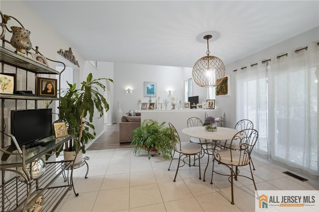 2 Guinevere Road Monroe Township, NJ 08831 - Photo 14 of 40 a view of a livingroom with furniture and a chandelier