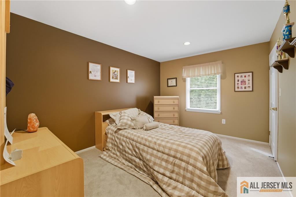 2 Guinevere Road Monroe Township, NJ 08831 - Photo 24 of 40 a bedroom with a bed and a window