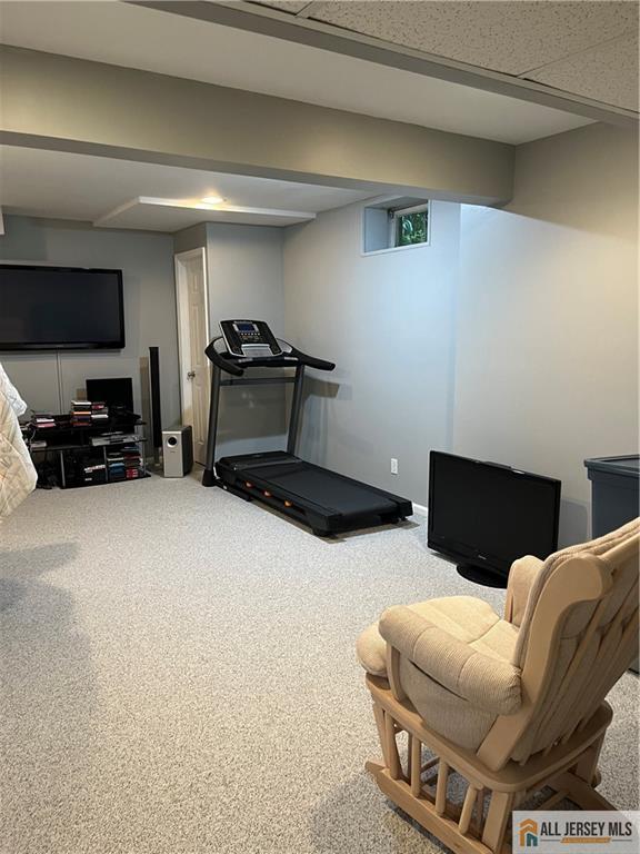 2 Guinevere Road Monroe Township, NJ 08831 - Photo 32 of 40 a living room with furniture and a flat screen tv