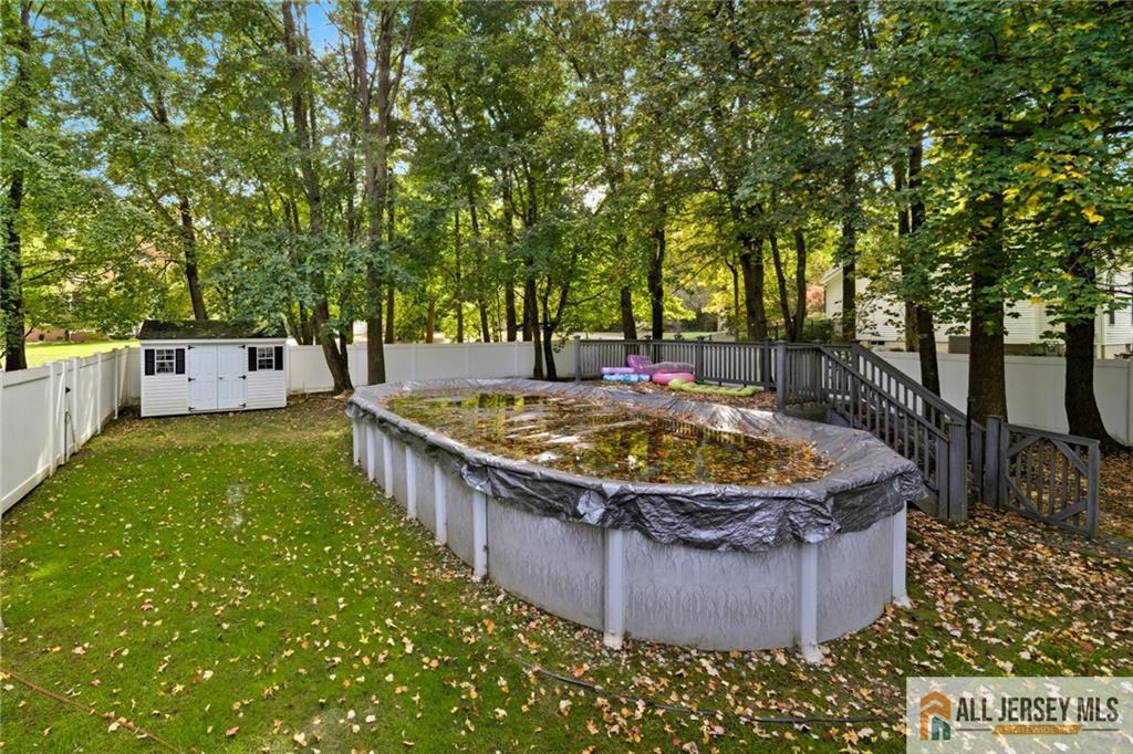2 Guinevere Road Monroe Township, NJ 08831 - Photo 36 of 40 a view of a jacuzzi with a tree in the background