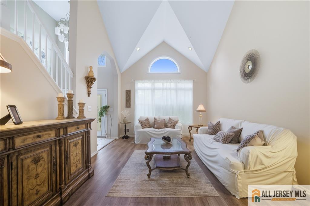 2 Guinevere Road Monroe Township, NJ 08831 - Photo 7 of 40 a living room with furniture and a fireplace
