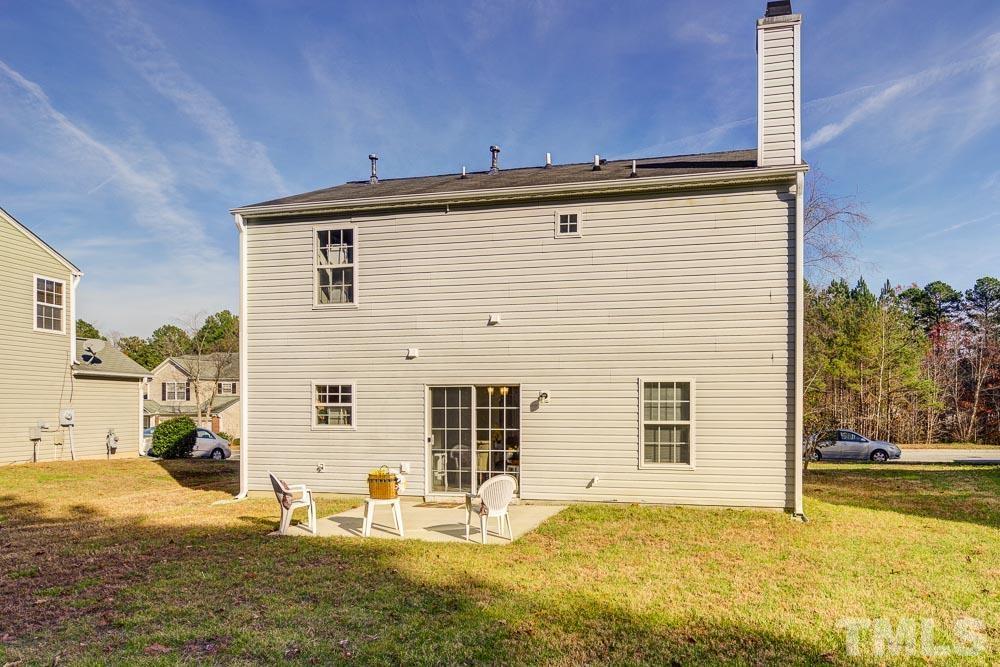 215 Pebblestone Drive Durham, NC 27703 - Photo 3 of 3 a front view of a house with a yard