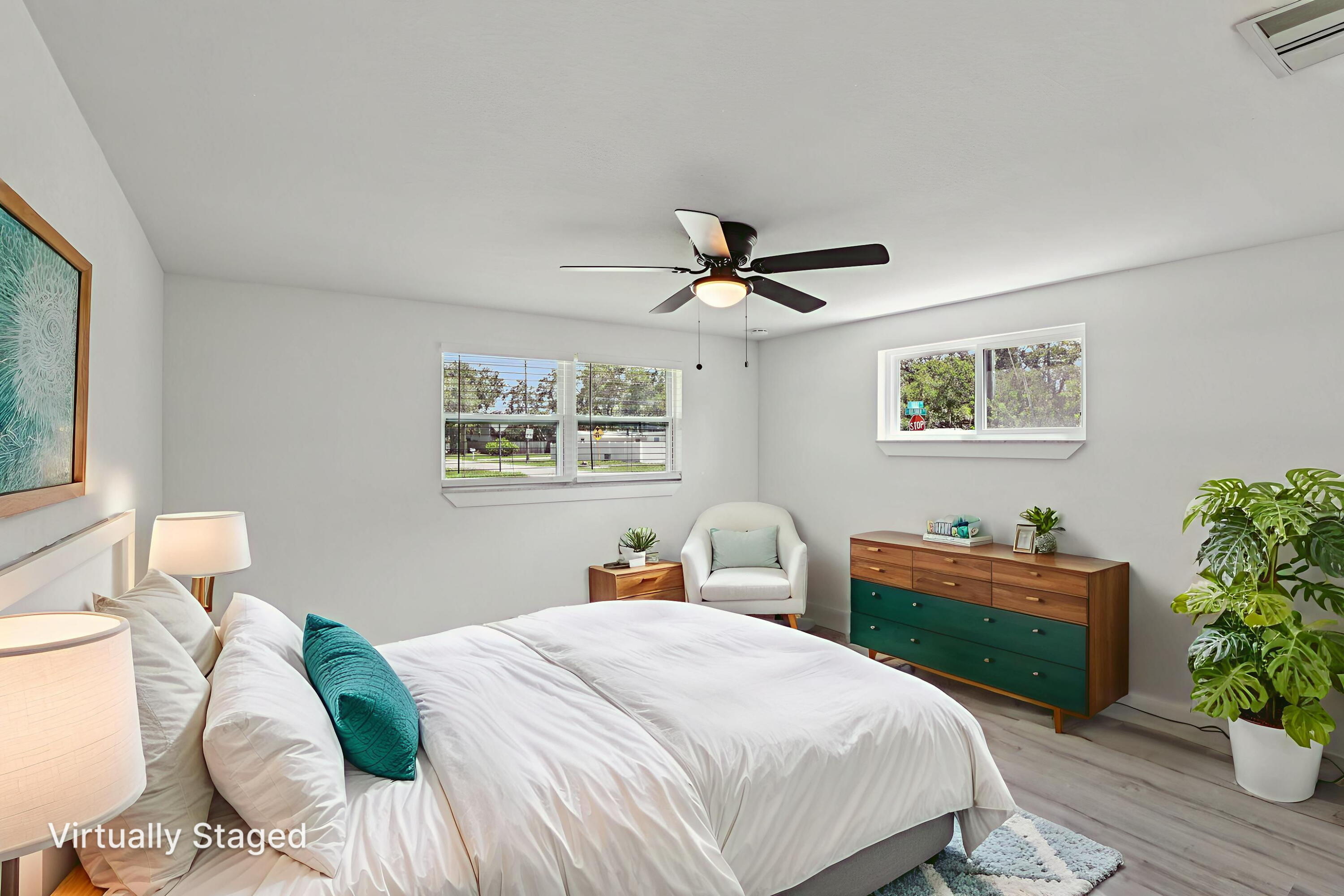 4946 Avery Road New Port Richey, FL 34652 - Photo 3 of 10 a bedroom with a bed dresser and a window