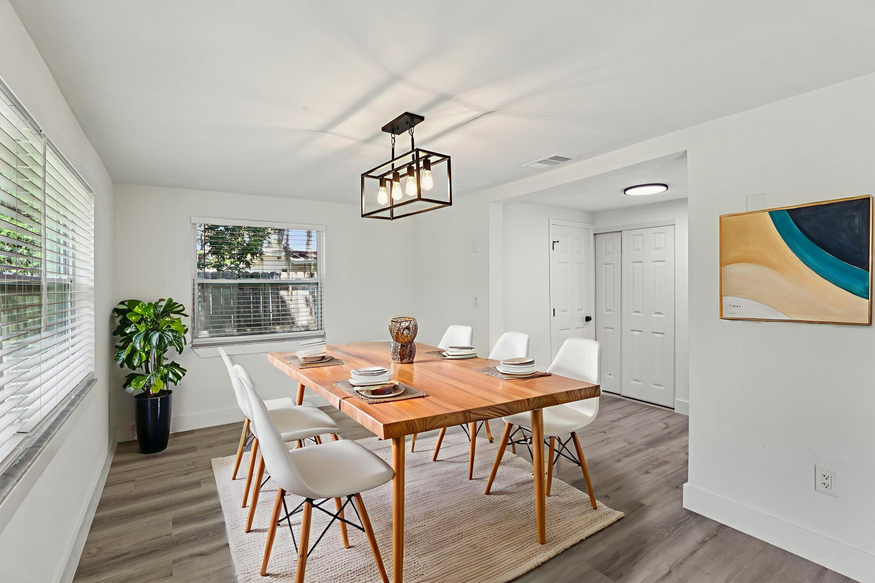 4946 Avery Road New Port Richey, FL 34652 - Photo 5 of 10 a view of a dining room with furniture window and wooden floor
