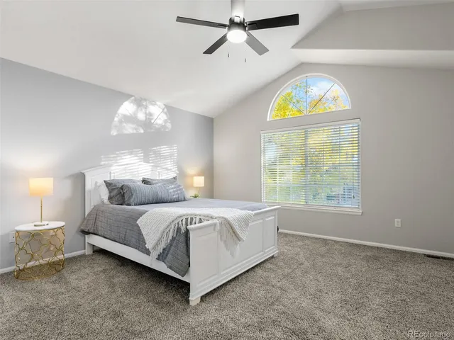 a bed room with a bed and a chandelier
