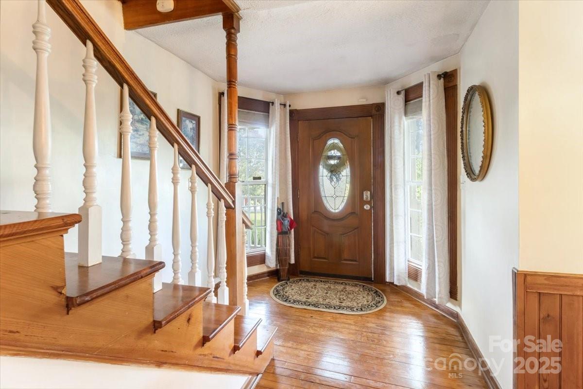 201 Murphy Hill Road Weaverville, NC 28787 - Photo 12 of 48 a view of a hallway with wooden floor and staircase