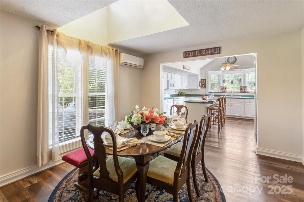 201 Murphy Hill Road Weaverville, NC 28787 - Photo 17 of 48 a dining room with furniture and wooden floor