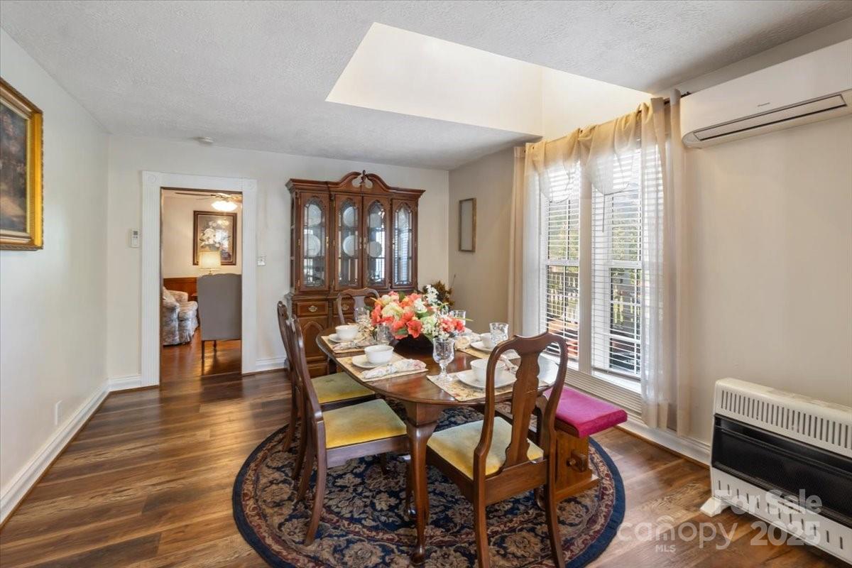 201 Murphy Hill Road Weaverville, NC 28787 - Photo 18 of 48 a dining room with furniture and wooden floor