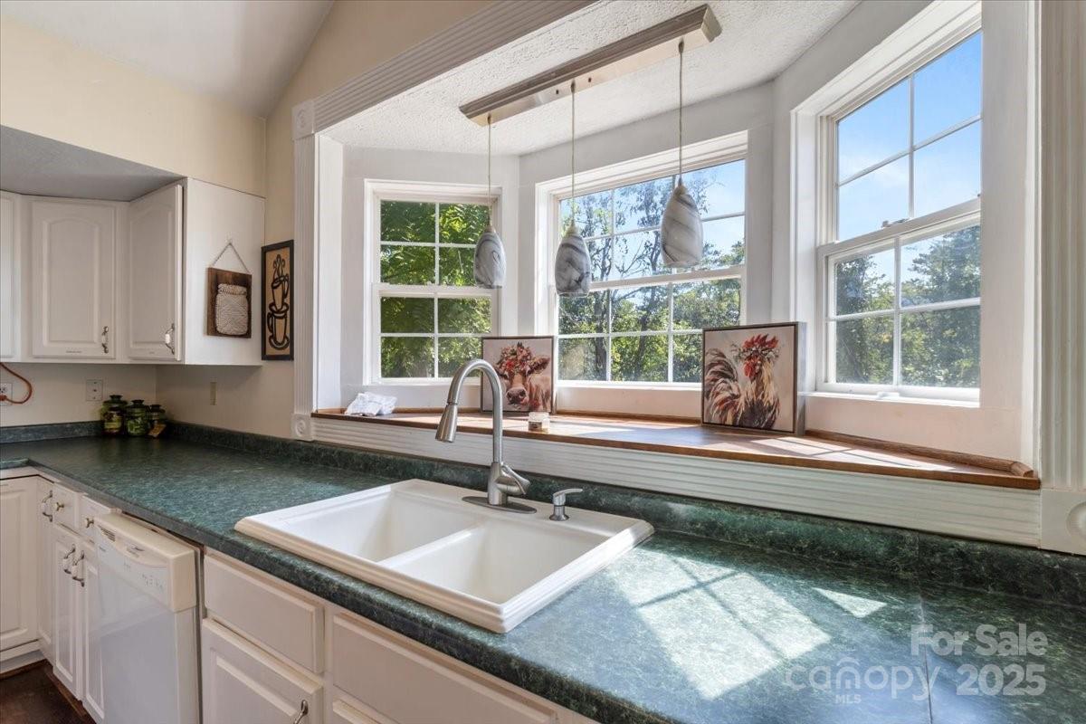 201 Murphy Hill Road Weaverville, NC 28787 - Photo 21 of 48 a kitchen with a sink and a large window