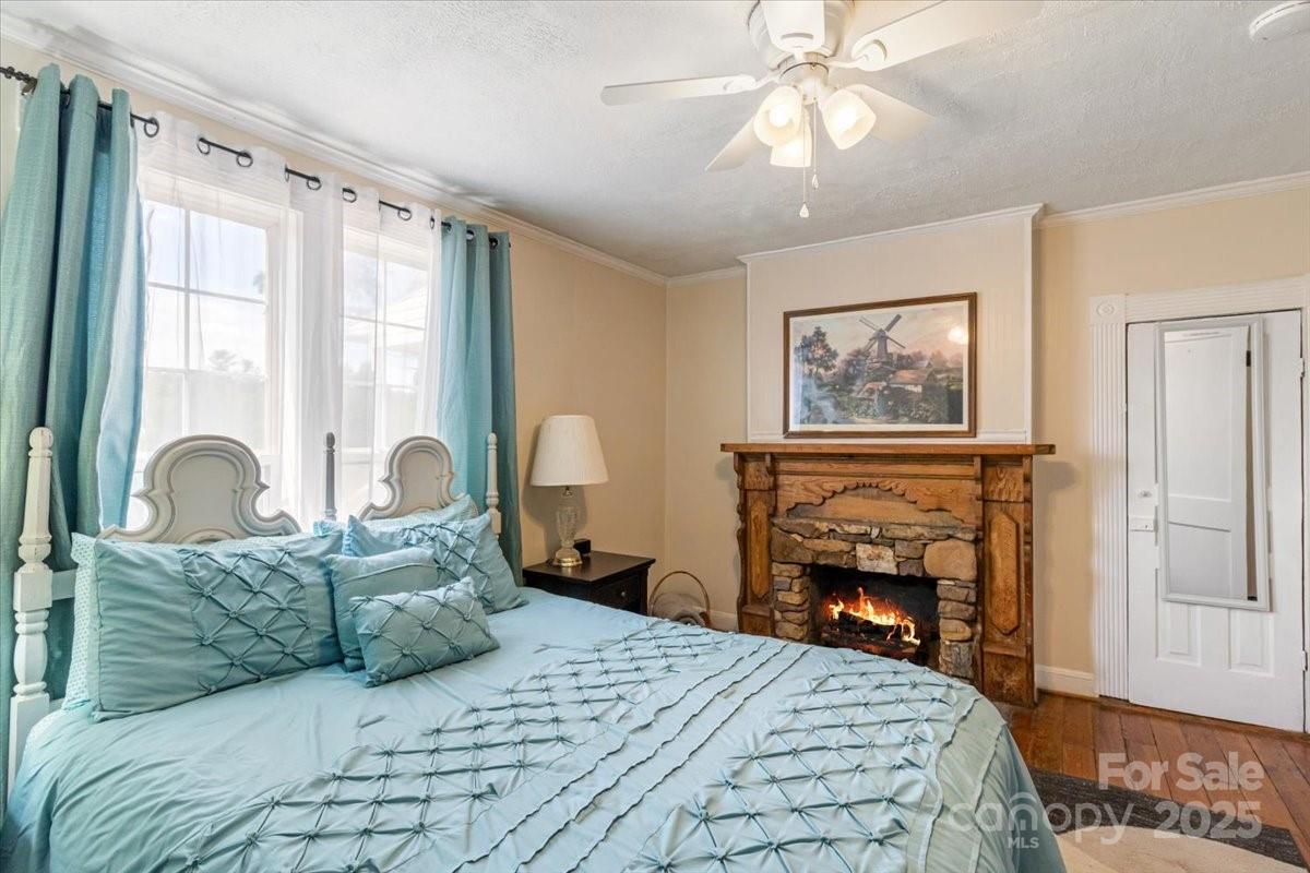 201 Murphy Hill Road Weaverville, NC 28787 - Photo 23 of 48 a large bedroom with a bed dresser and a large window