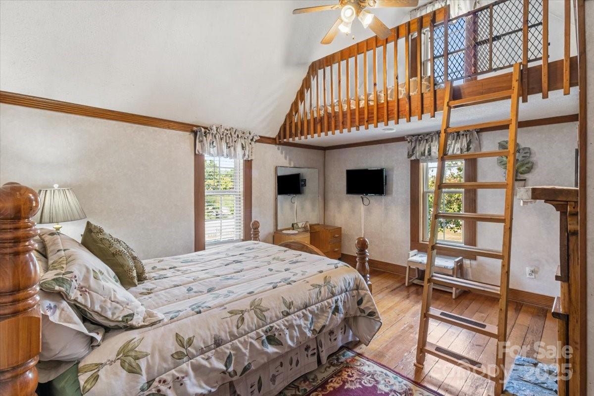 201 Murphy Hill Road Weaverville, NC 28787 - Photo 28 of 48 a bedroom with a bed next to a window