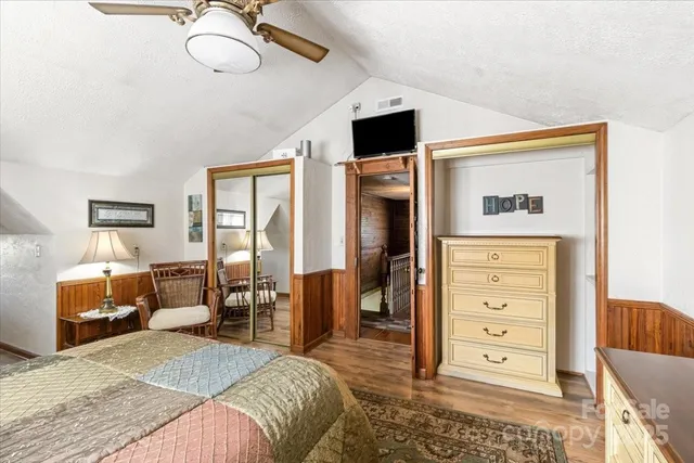 a bedroom with a bed and a dresser