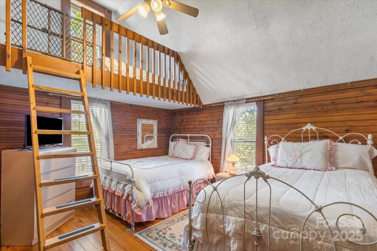 201 Murphy Hill Road Weaverville, NC 28787 - Photo 34 of 48 a bedroom with double bed a flat tv screen and dresser