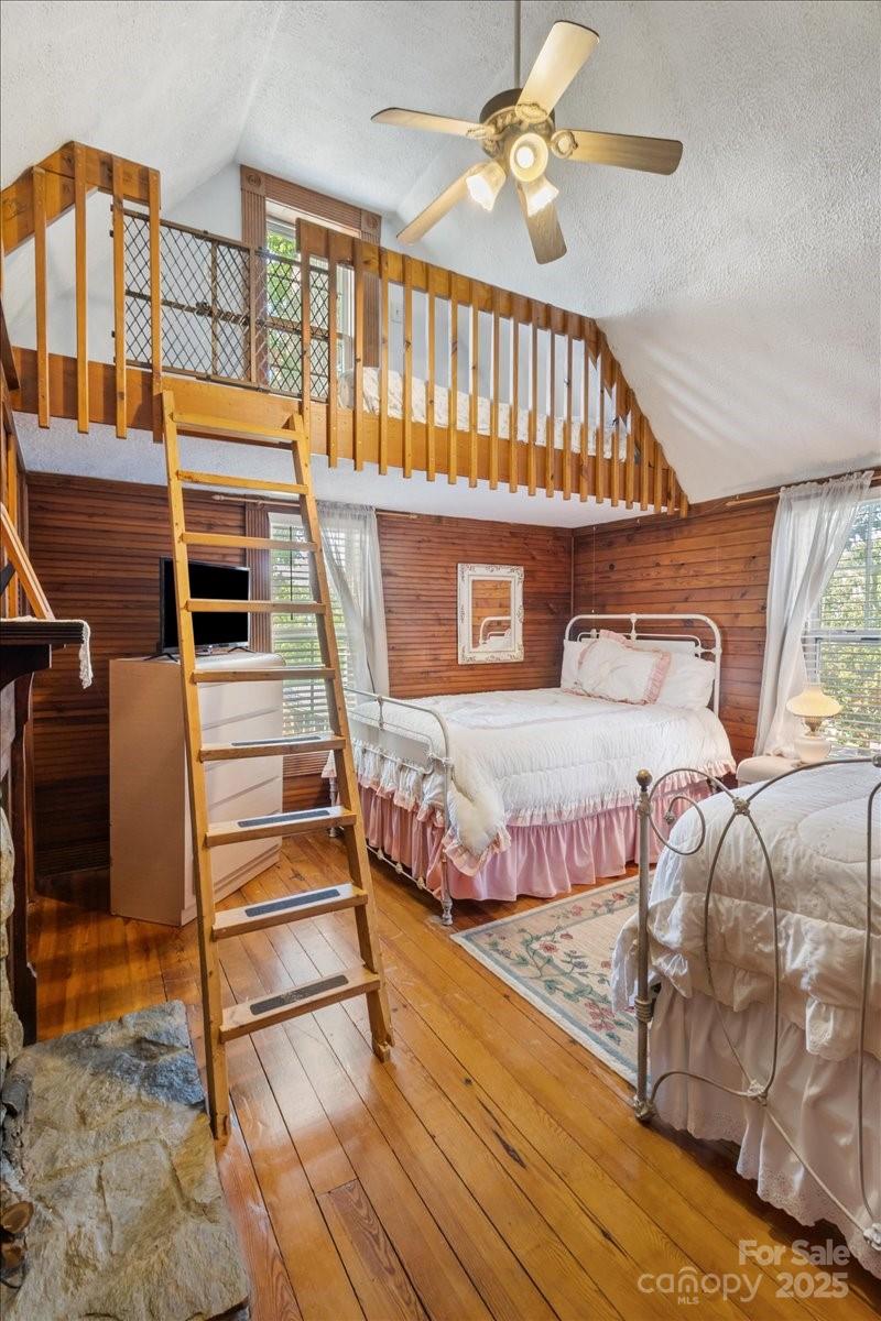 201 Murphy Hill Road Weaverville, NC 28787 - Photo 35 of 48 a bedroom with furniture and a chandelier