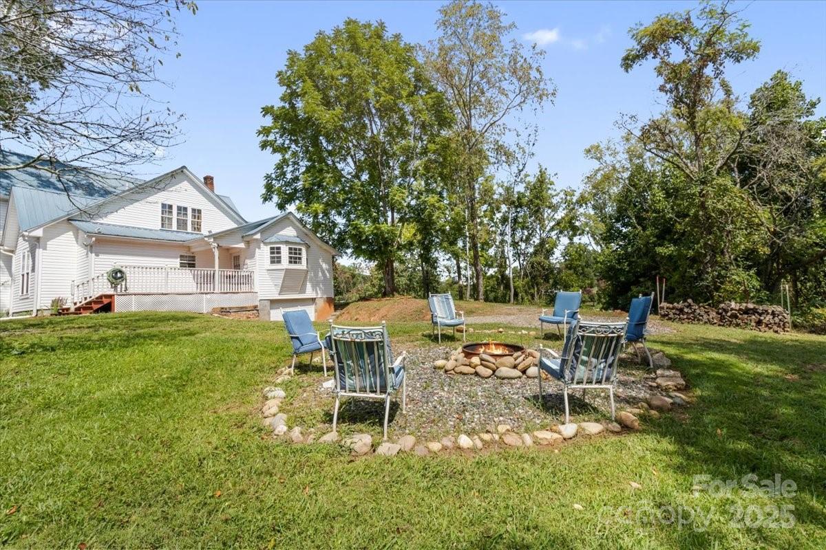 201 Murphy Hill Road Weaverville, NC 28787 - Photo 40 of 48 a view of a chairs and table in a yard
