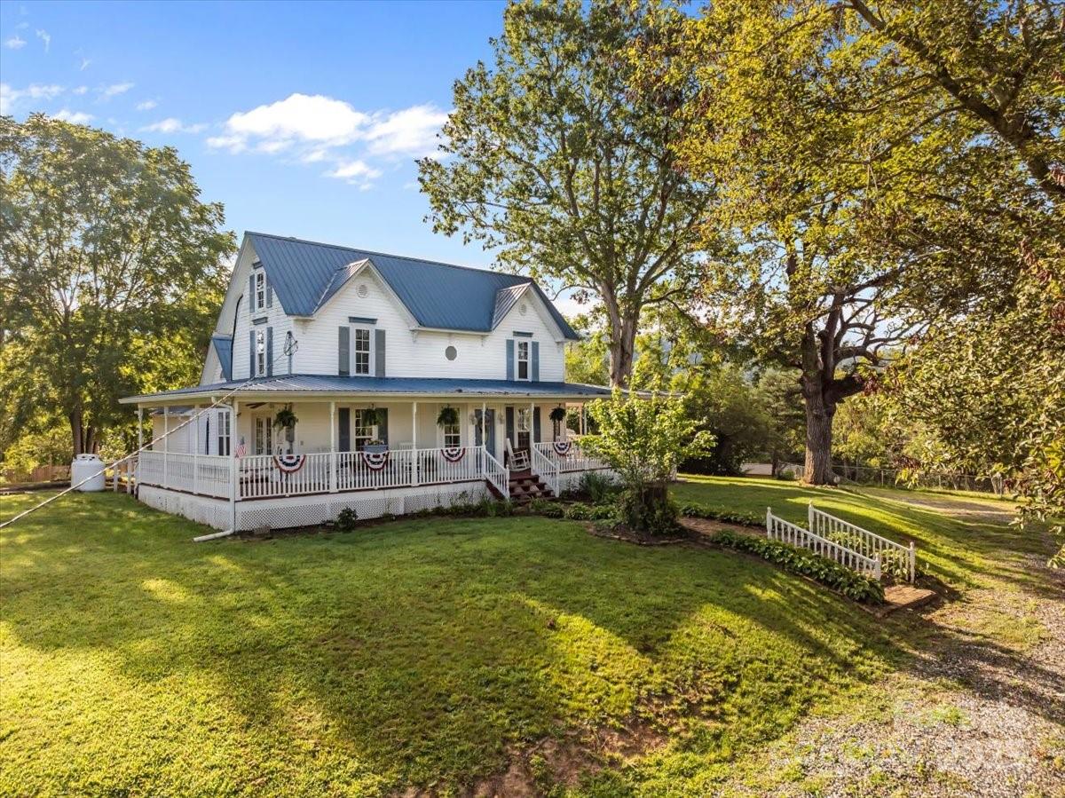 201 Murphy Hill Road Weaverville, NC 28787 - Photo 4 of 48 a view of a house with a big yard and large trees