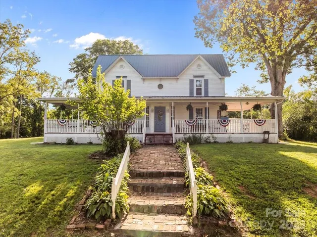 a front view of a house with a yard and porch