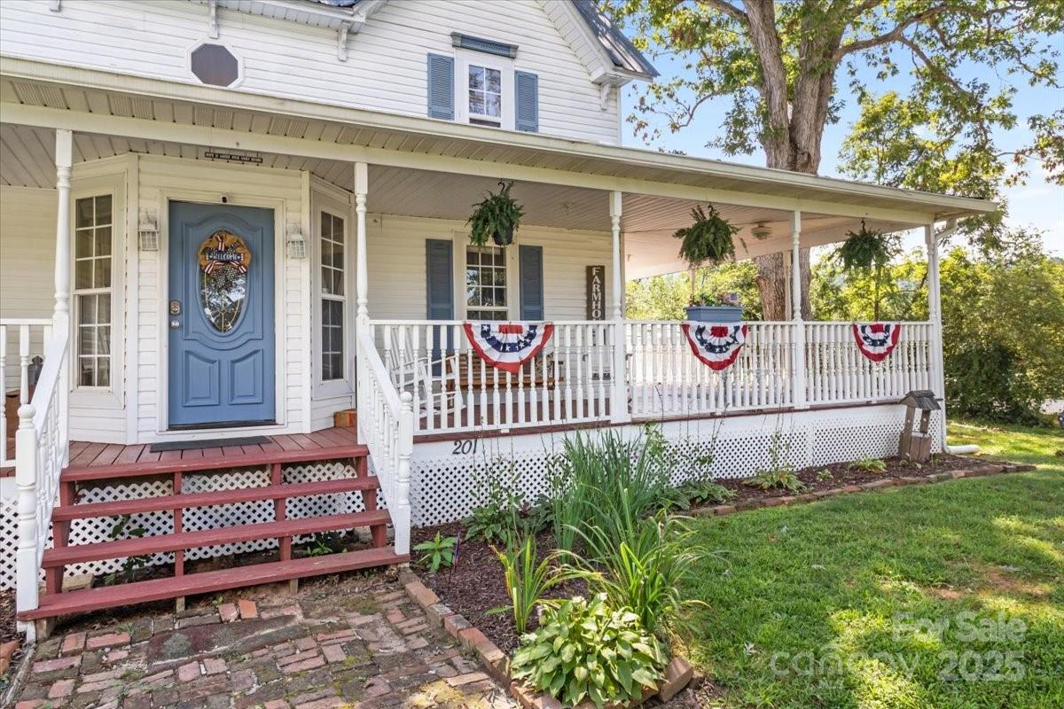201 Murphy Hill Road Weaverville, NC 28787 - Photo 5 of 48 a view of a door with a bench