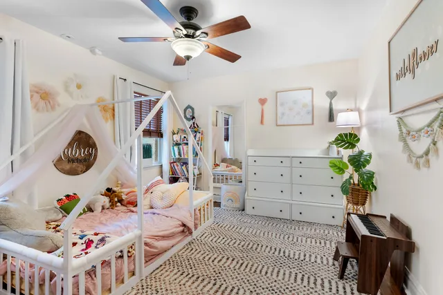 a bedroom with furniture and a window