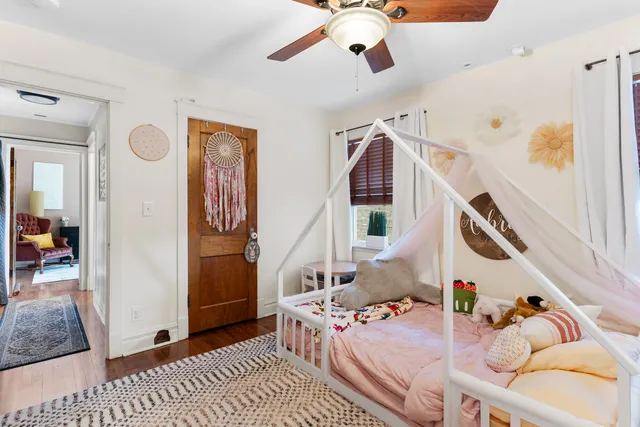 a bedroom with furniture and a chandelier