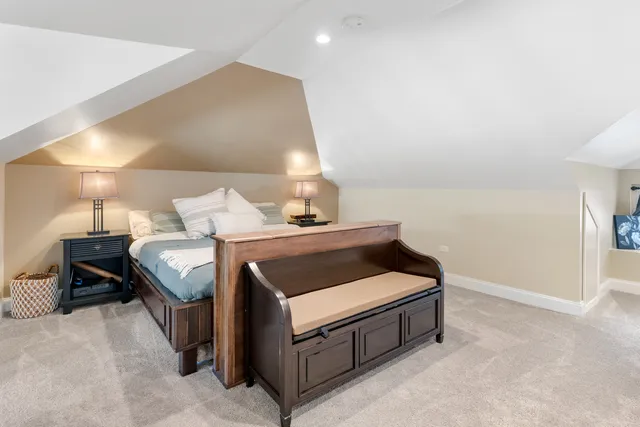 a bed room with a bed and a lamp