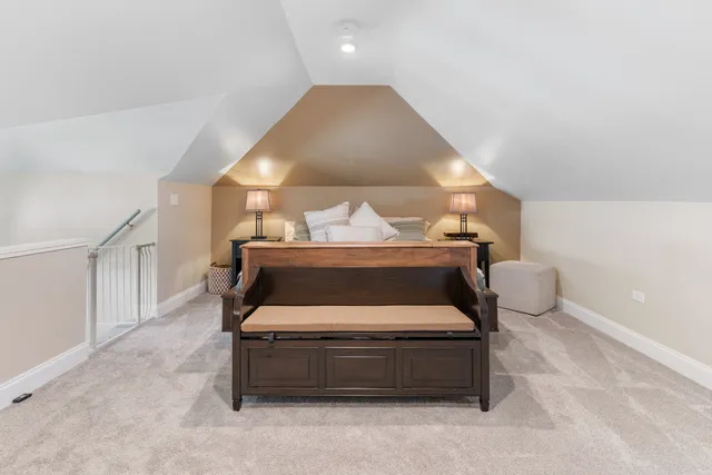 a bedroom with a bed and lamp