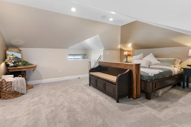 a living room with furniture and a gym machine