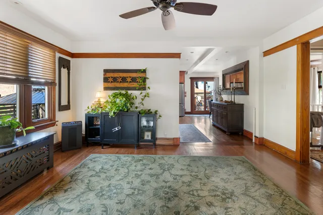 a living room with furniture and a potted plant