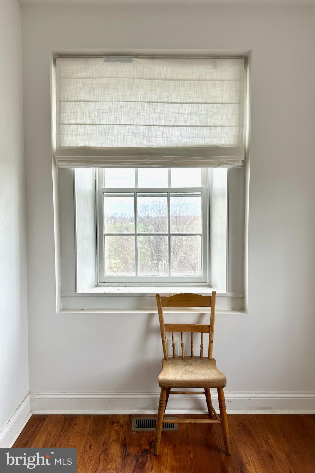 25789 Lambs Meadow Road Worton, MD 21678 - Photo 14 of 24 a bench sitting in a bedroom next to a window