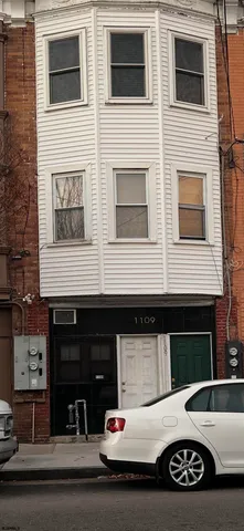 a view of a car park in front of house