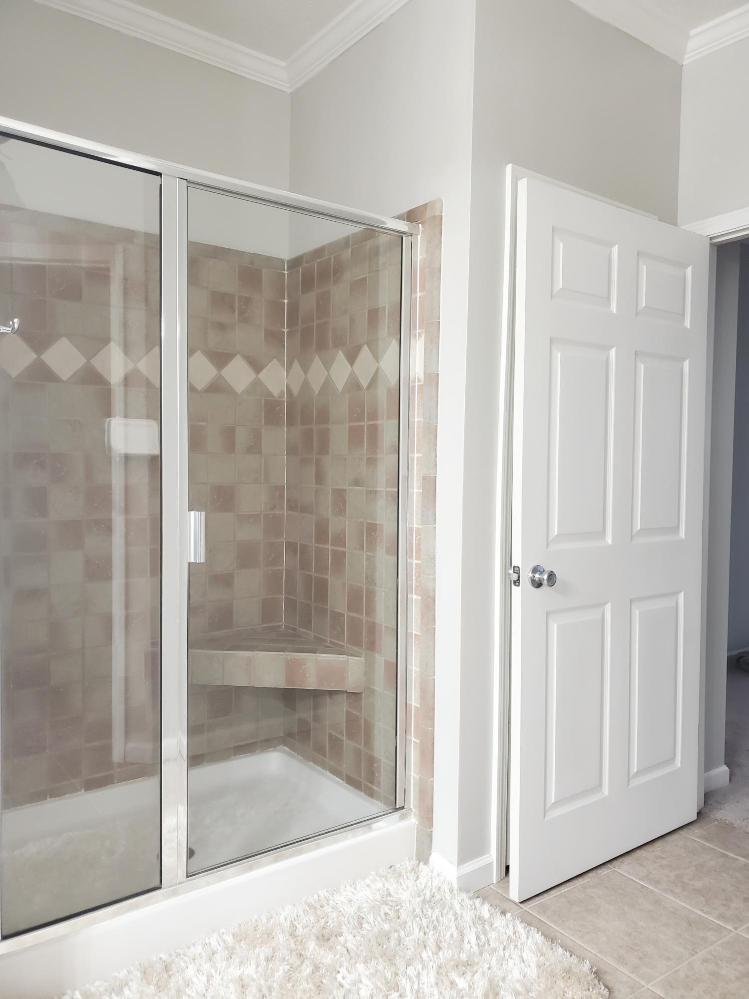 456 East Nursery Road Santa Rosa Beach, FL 32459 - Photo 11 of 21 a bathroom with a glass shower door