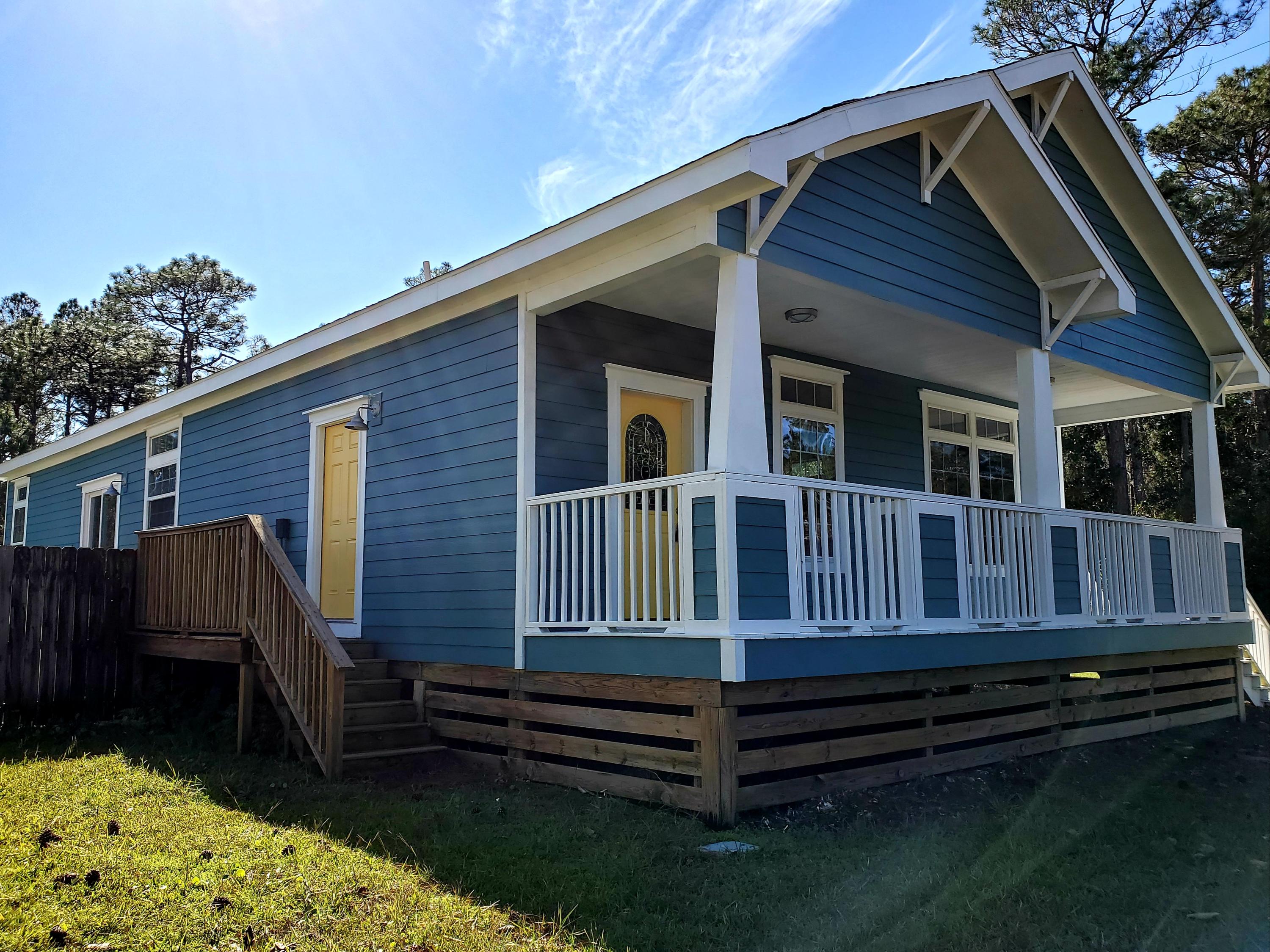 456 East Nursery Road Santa Rosa Beach, FL 32459 - Photo 19 of 21 a house view with a backyard space